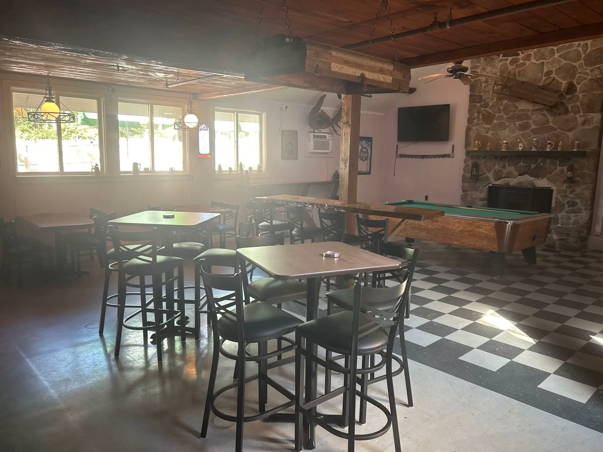 Pool table and seating inside The Wooden Tavern